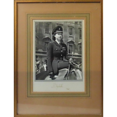 573 - A SIGNED PHOTOGRAPH OF PRINCESS ELIZABETH, silver gelatin image, the future Queen pictured in milita... 