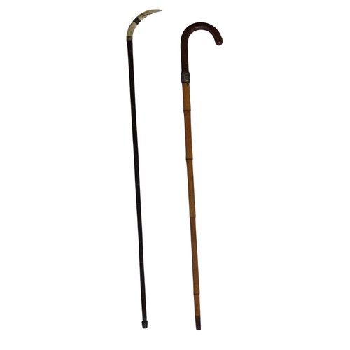 277 - ONE SILVER MOUNTED WALKING CANE with boars tusk handle (98cm)TOGETHER WITH FAUX BAMBOO WALKING STICK... 