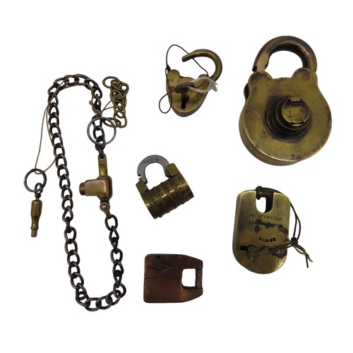 574 - A GROUP OF SIX VINTAGE BRASS LOCKS, the lot includes an unusual 19th Century letter combination lock... 