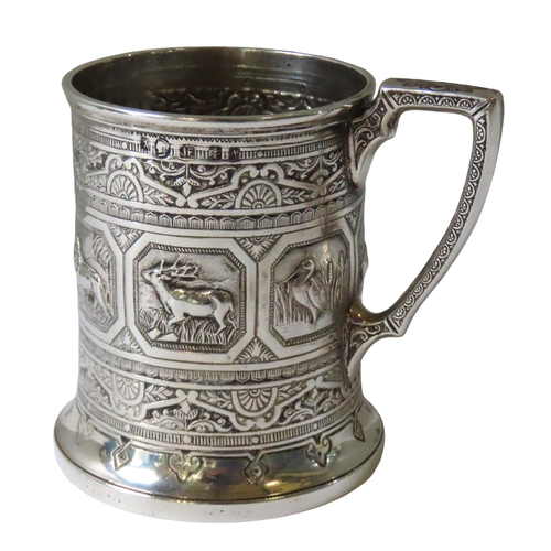 666 - AN ORNATE VICTORIAN SCOTTISH SILVER CHRISTENING MUG, the repousse decorated sides adorned with seven... 