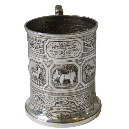 666 - AN ORNATE VICTORIAN SCOTTISH SILVER CHRISTENING MUG, the repousse decorated sides adorned with seven... 