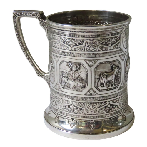 666 - AN ORNATE VICTORIAN SCOTTISH SILVER CHRISTENING MUG, the repousse decorated sides adorned with seven... 