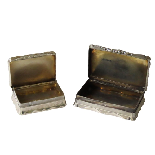 663 - TWO CARTOUCHE FORM SILVER SNUFF BOXES, both with engine turned decoration, the larger box marked Edw... 