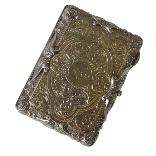 644 - AN ORNATE EDWARDIAN SILVER AIDE MEMOIRE, the monogrammed case covered in highly ornate chased scroll... 