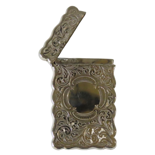 637 - AN EDWARDIAN SILVER CARD CASE, rectangular cartouche form with ornate chased scroll foliate decorati... 