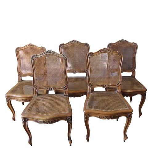 14 - A GROUP OF FIVE LOUIS XV STYLE FRUITWOOD SIDE CHAIRS, cartouche form cane backs over shaped caner se... 