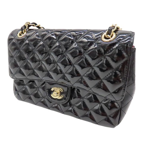 287 - CHANEL BLACK PATENT QUILTED FLAP BAG with authentication card and Chanel dust bag.Main compartment w... 