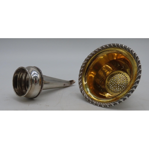 636 - A SILVER PLATED WINE FUNNEL, in two sections, the top strainer with a gadrooned edge and gilded inte... 