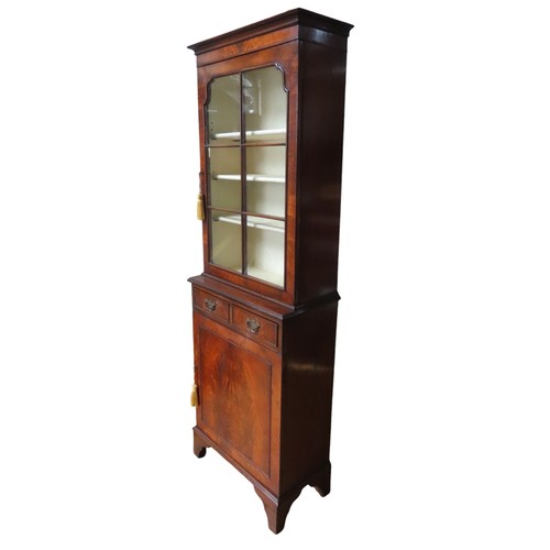 38 - A 19TH CENTURY-STYLE MAHOGANY BOOKCASE CUPBOARD, in two sections, comprising a glazed cabinet door e... 