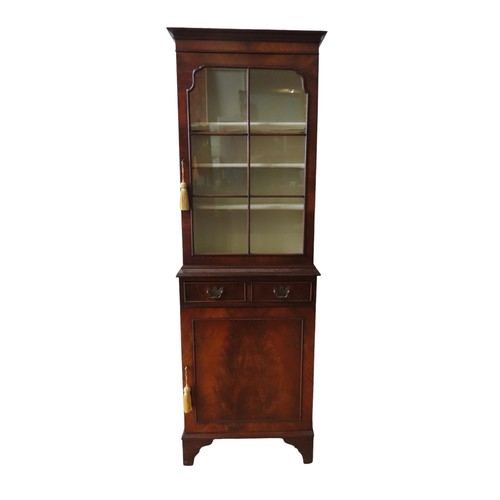 38 - A 19TH CENTURY-STYLE MAHOGANY BOOKCASE CUPBOARD, in two sections, comprising a glazed cabinet door e... 