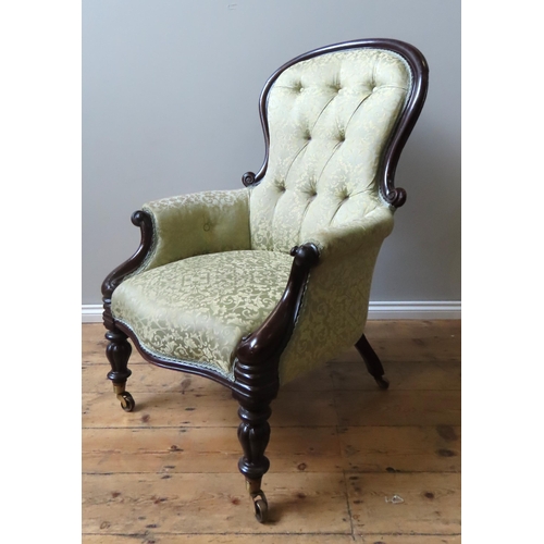 44 - A VICTORIAN SPOON BACK EASY CHAIR, the scroll carved frame covered in a scroll pattern pale gold dam... 