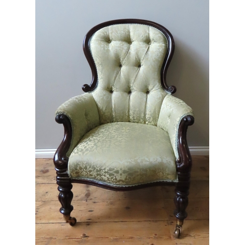 44 - A VICTORIAN SPOON BACK EASY CHAIR, the scroll carved frame covered in a scroll pattern pale gold dam... 