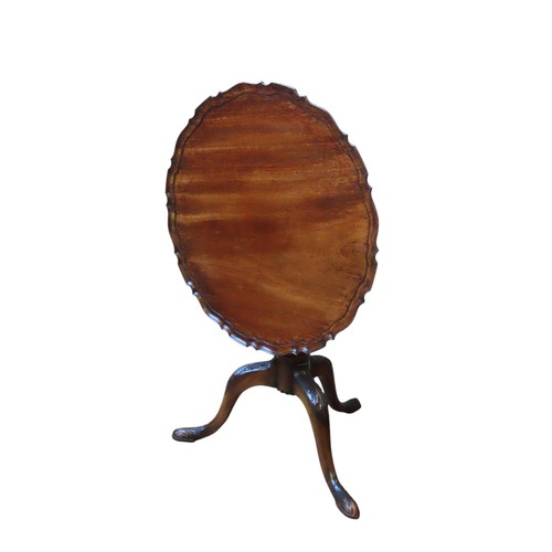 3 - A MAHOGANY TILT TOP WINE TABLE, EARLY 20TH CENTURY, circular pie crust edge top raised on a fluted b... 