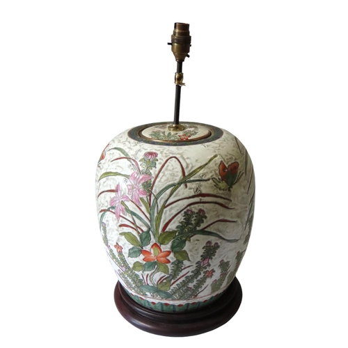 347 - A LARGE CHINESE GINGER JAR AND COVER, the enamel painted sides decorated with flowering stems and bu... 