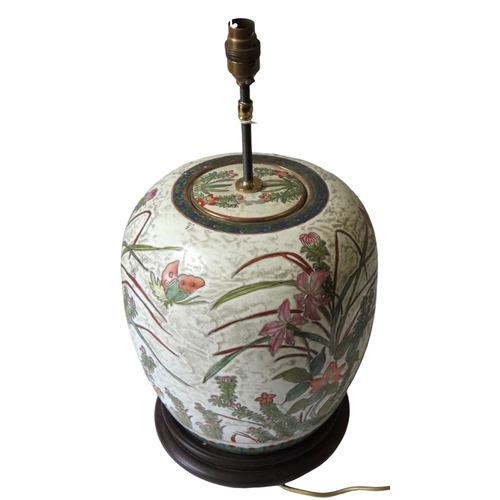 347 - A LARGE CHINESE GINGER JAR AND COVER, the enamel painted sides decorated with flowering stems and bu... 