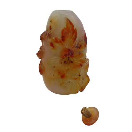 583 - AN AGATE SNUFF BOTTLE, carved melon form entwined with foliage, with stopper7.5 cm long