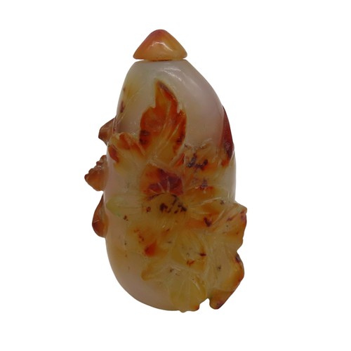 583 - AN AGATE SNUFF BOTTLE, carved melon form entwined with foliage, with stopper7.5 cm long