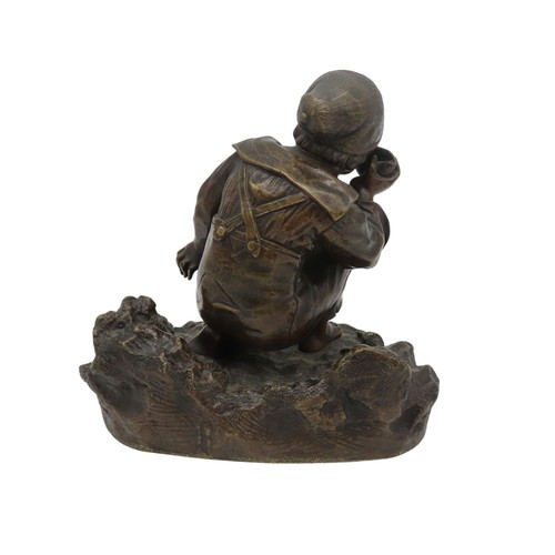 591 - A BRONZE FIGURE OF A KNEELING BOY, modelled in sailor's attire holding a conch to his ear, knelt on ... 