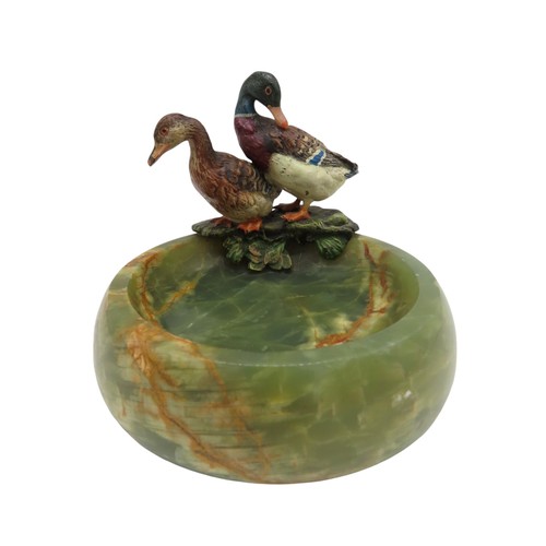 585 - A PAIR OF AUSTRIAN SCHOOL COLD PAINTED BRONZE DUCKS, 20TH CENTURY, mounted on a turned onyx dish9 cm... 