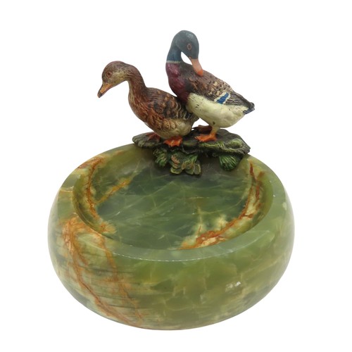 585 - A PAIR OF AUSTRIAN SCHOOL COLD PAINTED BRONZE DUCKS, 20TH CENTURY, mounted on a turned onyx dish9 cm... 