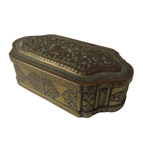 143 - 19TH CENTURY INDIAN BRASS ENGRAVED AND REPOUSSE WORK TOBACCO BOX AND COVER decorated with beasts and... 