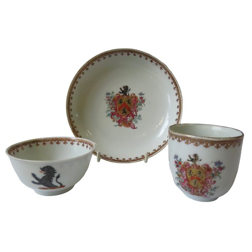 144 - 19TH CENTURY CHINESE EXPORT PORCELAIN ARMORIAL TEA BOWL, CUP AND SAUCER, decorated with crest