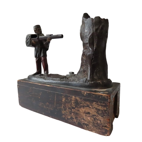 570 - AMERICAN CAST IRON CREEDMOOR BANK MECHANICAL MONEY BOX mounted on a later wooden box base.