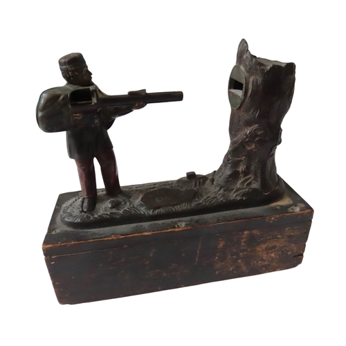 570 - AMERICAN CAST IRON CREEDMOOR BANK MECHANICAL MONEY BOX mounted on a later wooden box base.