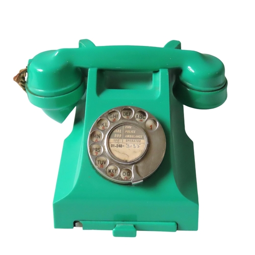 581 - A VINTAGE GPO BAKELITE TELEPHONE, CIRCA 1950, in a vibrant green casing, Type 332L, converted to wor... 