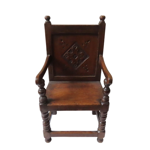 8 - A 19TH CENTURY CHILD'S OAK WAINSCOT CHAIR, in the Charles II style, with carved back panel, scroll a... 