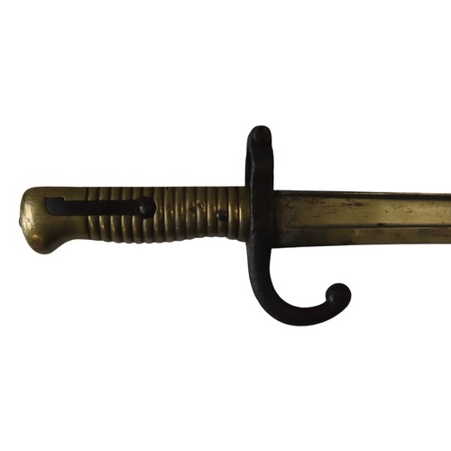 233 - A FRENCH 1868 PATTERN BAYONET WITH BRASS GRIP AND STEEL SCABBARD.72 cms