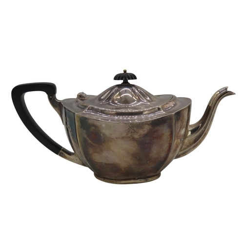 698 - A VINTAGE SILVER TEAPOT, fluted tapering oval form with ebonised handle and scrolling fluted spout, ... 