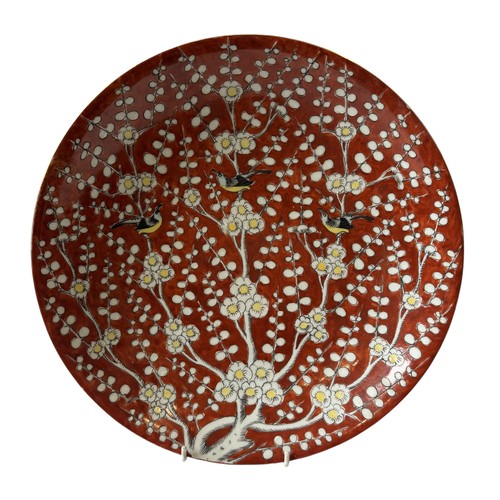 295 - A LARGE CHINESE DISH, painted with a scene depicting three birds perched amongst blossoming branches... 