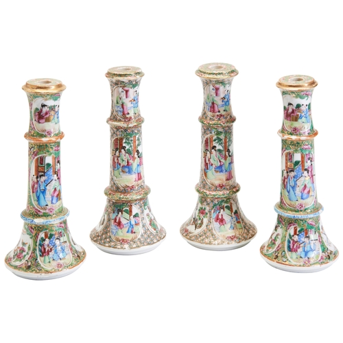 143 - TWO PAIRS OF FAMILLE ROSE CANDLESTICKS QING DYNASTY, 19TH CENTURY粉彩烛台两组 清 19世纪decorated in the typic... 