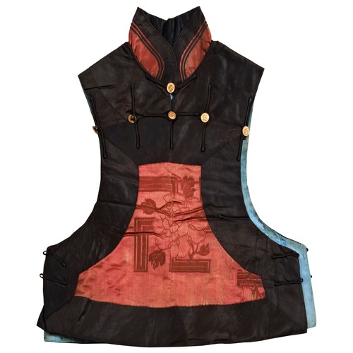 348 - A RED AND BLACK SILK BROCADE WAISTCOAT (JINSHEN)LATE QING DYNASTY刺绣马褂  晚清with a pale-blue silk linin... 