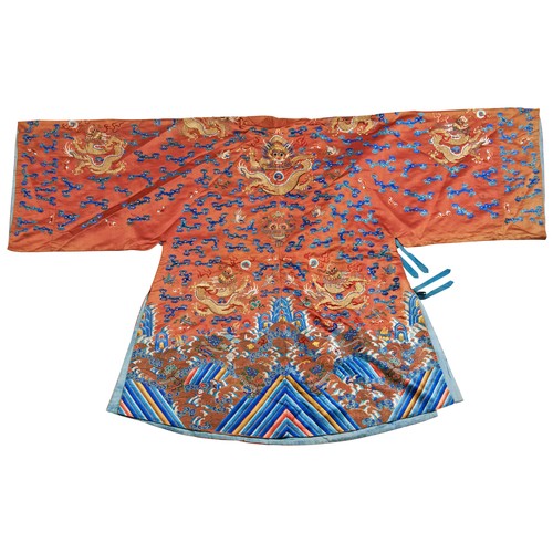 360 - A CORAL-GROUND EMBROIDERED SILK 'DRAGON' ROBE (JIFU)QING DYNASTY, 19TH CENTURY刺绣海水龙纹吉服 清 19世纪the sil... 