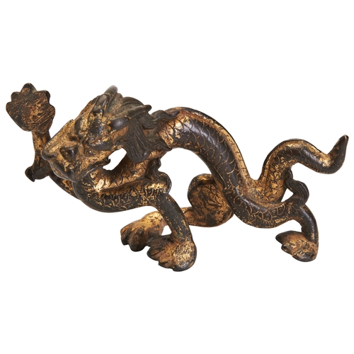 42 - A GILT BRONZE 'DRAGON' SCROLL WEIGHTPROBABLY TANG DYNASTY铜鎏金龙 或为唐代bronze dragon with gold gilding, o... 