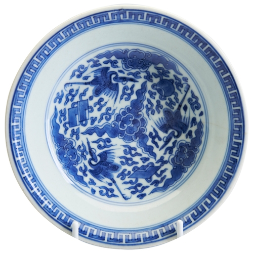 56 - A BLUE AND WHITE 'FLYING-CRANES' DISHKANGXI PERIOD WITH A SIX CHARACTER MARK QI SHI BAO DING ZHI ZHE... 