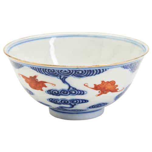 186 - AN IRON-RED-DECORATED BLUE AND WHITE ‘BATS AND CLOUDS’ BOWLGUANGXU SIX CHARACTER MARK AND OF THE PER... 