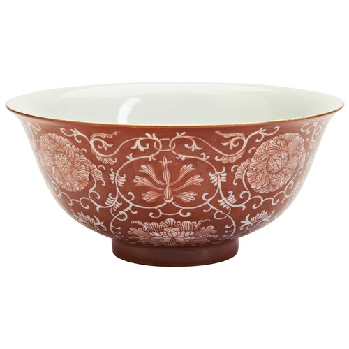 192 - AN IRON RED BOWL WITH LOTUS DECORATION, DAOGUANG MARK矾红缠枝莲纹碗 大清道光年制 on the ground of copper red, Daq... 