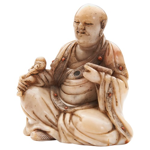 A RARE CARVED SOAPSTONE FIGURE OF A SEATED LOHAN 