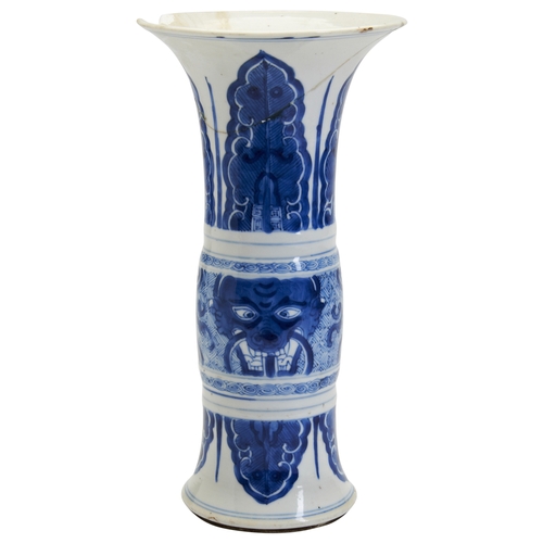 79 - A SMALL BLUE AND WHITE GU-SHAPED VASE KANGXI, 1662-1722青花兽面芭蕉纹花孤 清 康熙painted in a rich cobalt blue i... 