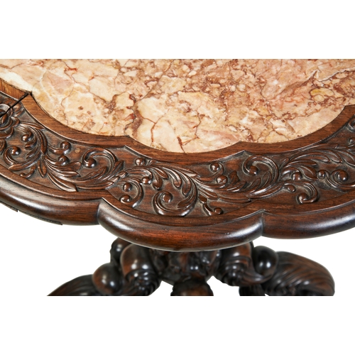 447 - A FINE CARVED HUANGHUALI 'LILY' TABLEQING DYNASTY, EARLY 19TH CENTURY黄花梨巴洛克风格桌  清 19世纪the shaped cir... 