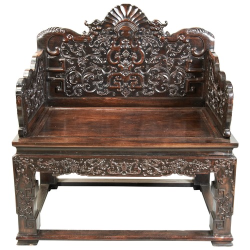 449 - AN IMPRESSIVE CARVED ZITAN THRONE CHAIRMID-QING PERIOD紫檀雕龙椅 清中期the shaped stepped back and sides fin... 