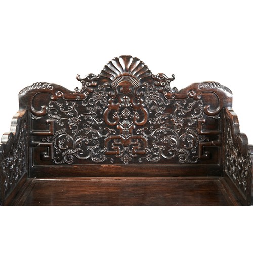 449 - AN IMPRESSIVE CARVED ZITAN THRONE CHAIRMID-QING PERIOD紫檀雕龙椅 清中期the shaped stepped back and sides fin... 