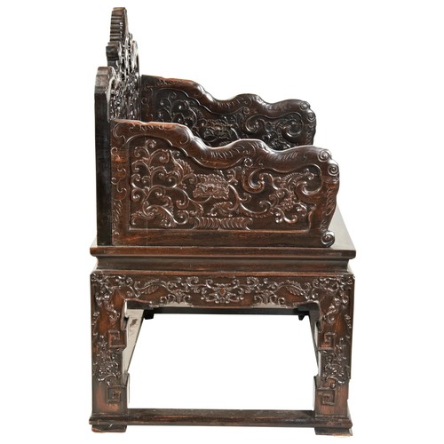 449 - AN IMPRESSIVE CARVED ZITAN THRONE CHAIRMID-QING PERIOD紫檀雕龙椅 清中期the shaped stepped back and sides fin... 