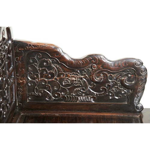 449 - AN IMPRESSIVE CARVED ZITAN THRONE CHAIRMID-QING PERIOD紫檀雕龙椅 清中期the shaped stepped back and sides fin... 