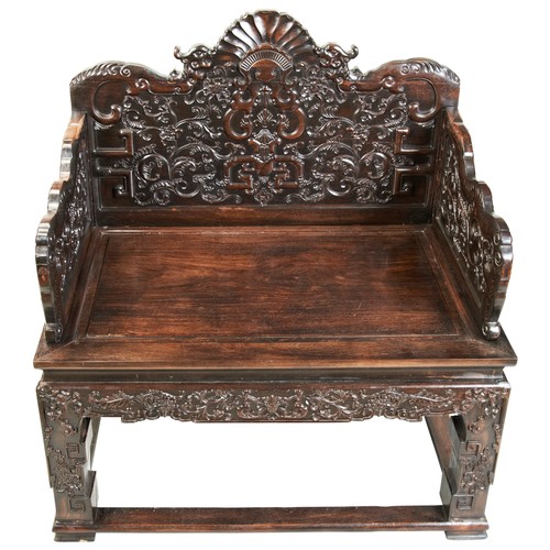 449 - AN IMPRESSIVE CARVED ZITAN THRONE CHAIRMID-QING PERIOD紫檀雕龙椅 清中期the shaped stepped back and sides fin... 