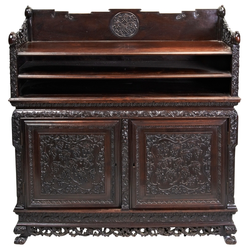 453 - AN UNUSUAL CARVED HUALI-WOOD SIDE CABINETQING DYNASTY, 19TH CENTURY花梨柜子  清 十九世纪 the three quarter ga... 