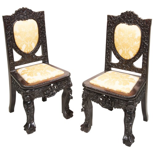 458 - A PAIR OF GOOD CARVED 'ZITAN' HARDWOOD SIDE CHAIRSQING DYNASTY, 19TH CENTURY紫檀椅一对 清 十九世纪 covered in ... 